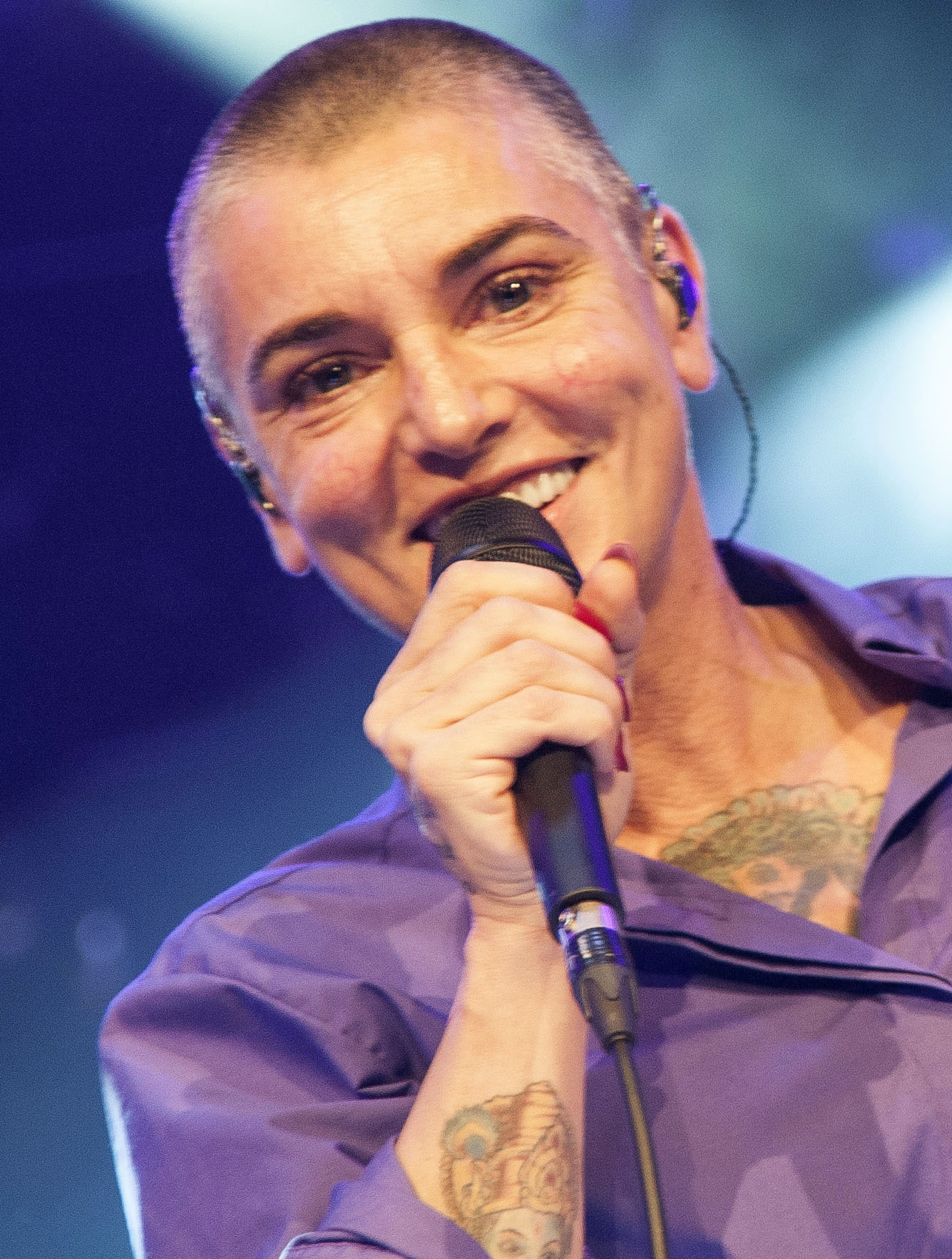 Sinead O'Connor singing a song at concert